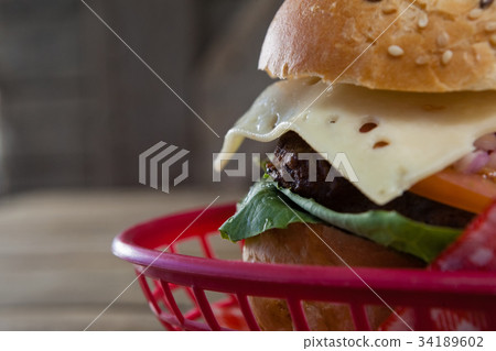 Olive oil with olive and bread kept on chopping board Olive oil with olive and bread kept on chopping board 34189602