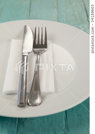 Hamburger and french fries on paper 34189603