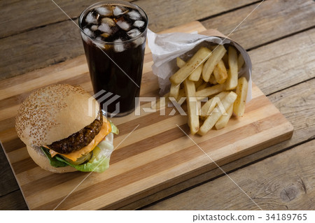 Hamburger in plate with glass of cold drink Hamburger in plate with glass of cold drink 34189765