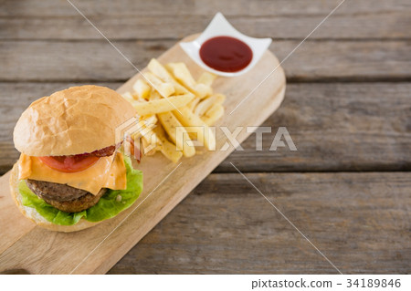 Close-up of hamburger and french fries in take way bag 34189846