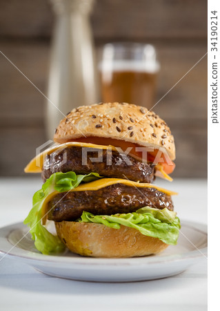 Snacks and cold drink on wooden table 34190214