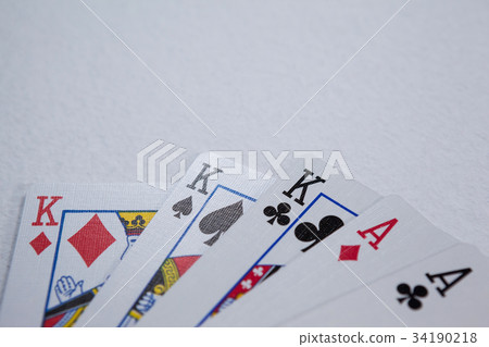 Pair of dice and playing cards on poker table 34190218