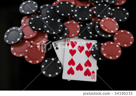 Playing cards arranged on poker table 34190235