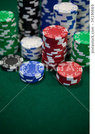 Playing cards, dices and casino chips on poker table Playing cards, dices and casino chips on poker table 34190669