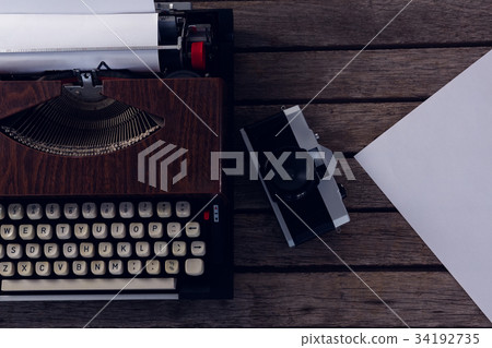High angle view of coffee cup with paper and fountain pen High angle view of coffee cup with paper and fountain pen 34192735