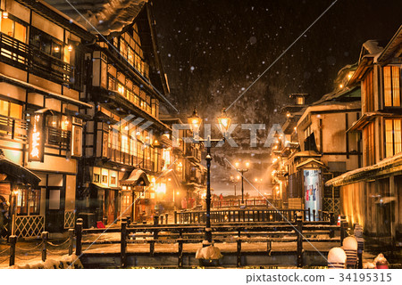 Ginzan hot spring snow scene at night 34195315