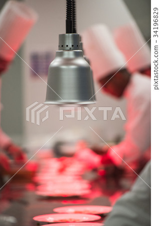 Chefs in luxury hotel restaurant kitchen cooking, Chefs in luxury hotel restaurant kitchen cooking, 34196829
