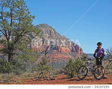 Woman mountain biking in the red rocks, Sedona Woman mountain biking in the red rocks, Sedona 34197295