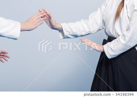 Two girls practice Aikido on martial arts training Two girls practice Aikido on martial arts training 34198394