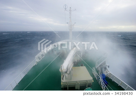 Ship's Bow diving into a big splashing wave Ship's Bow diving into a big splashing wave 34198430