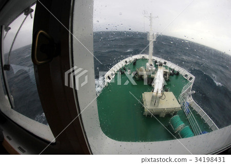 Ship's Bow diving into a big splashing wave 34198431