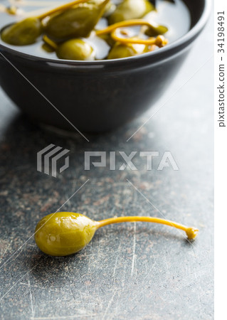 Pickled caper berries. 34198491