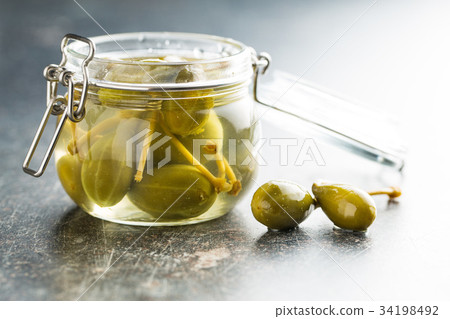 Pickled caper berries. 34198492