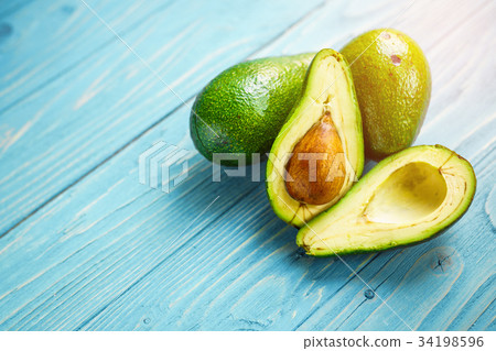 Avocado on wooden background 34198596