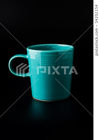 Blue cup of coffee on black background Blue cup of coffee on black background 34202154