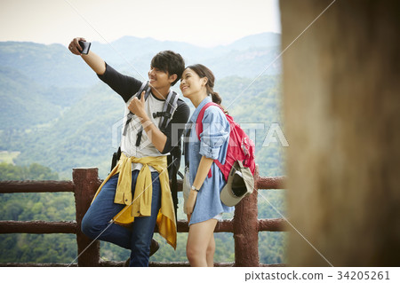The man and girl are very excited when taking selfie of their trip 34205261