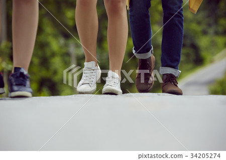 the footsteps of the people walking on the road 34205274