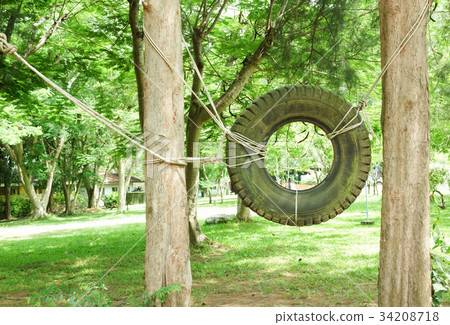 Swings made of tires in  Boy Scout camp 34208718