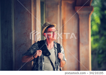 Young man tourism in Asian  French ancient village 34210195