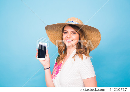 Happy smiling woman showing cell phone with black Happy smiling woman showing cell phone with black 34210717