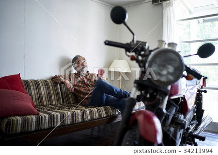 Senior man looking at a bike 34211994