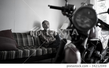 Senior man looking at a bike Senior man looking at a bike 34212049