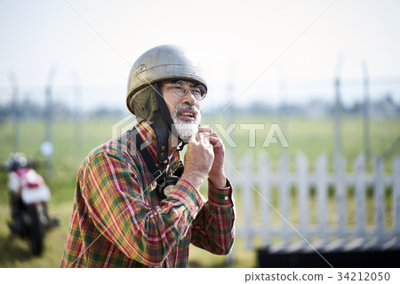 Senior man riding a motorcycle Senior man riding a motorcycle 34212050