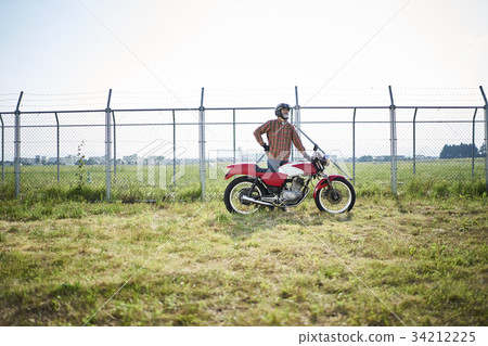 Senior men riding a motorcycle 34212225