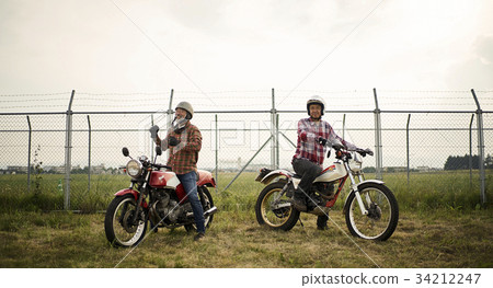 Senior men riding a motorcycle 34212247