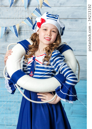 little girl holding a lifebuoy and laughing little girl holding a lifebuoy and laughing 34213192