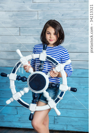 Girl holding a steering wheel 34213321