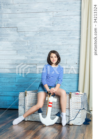 Girl sitting and keep anchor Girl sitting and keep anchor 34213324