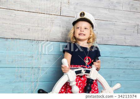 Little girl hold steering wheel Little girl hold steering wheel 34213374
