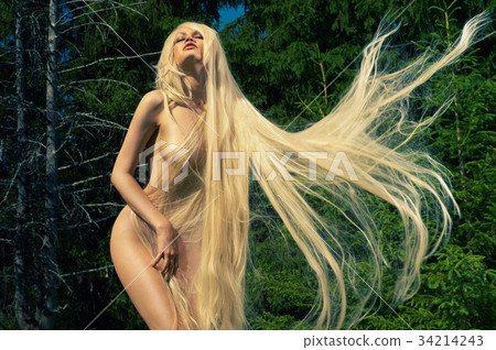 Beautiful lady in the coniferous forest 34214243