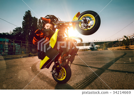 Child on a motorcycle Child on a motorcycle 34214669