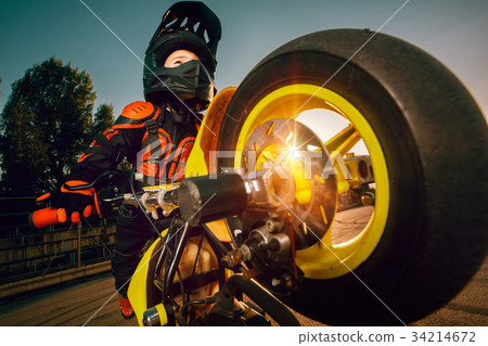 Child on a motorcycle Child on a motorcycle 34214672