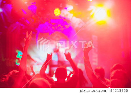 The silhouettes of concert crowd in front of The silhouettes of concert crowd in front of 34215566