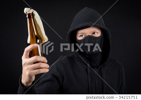 Protester or terrorist with Molotov cocktail 34215751