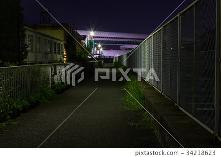 Dark night road along the river 34218623