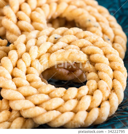 Butter Chakli with spicy famous South Indian Snack Butter Chakli with spicy famous South Indian Snack 34222795