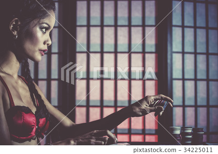 Sexy and happy female poker player Sexy and happy female poker player 34225011
