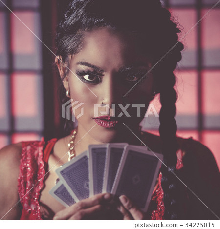 Sexy and happy female poker player 34225015