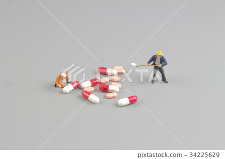 the worker of figure in front of pills the worker of figure in front of pills 34225629