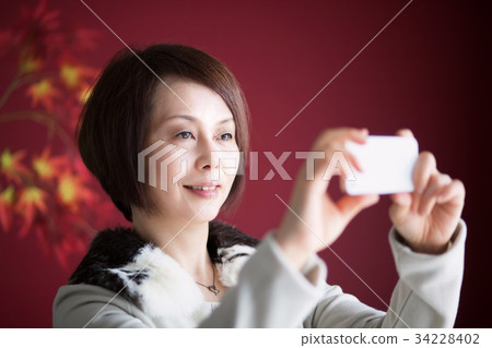 Middle woman smartphone photography photo Middle woman smartphone photography photo 34228402
