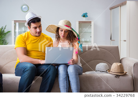 Young family preparing for travel vacation Young family preparing for travel vacation 34229768
