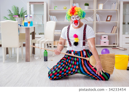 Funny clown doing cleaning at home Funny clown doing cleaning at home 34233454