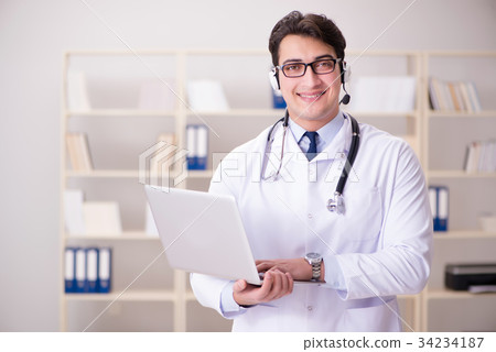 Young man doctor in medical concept 34234187