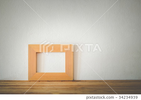 Gold photo frame on wooden Gold photo frame on wooden 34234939