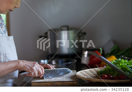 Grandmother cooking 34235128