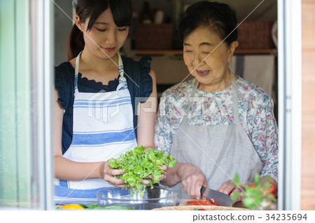 Grandmother grandson cooking Grandmother grandson cooking 34235694